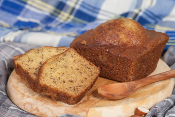 Homemade banana bread sliced on a table . rustic style