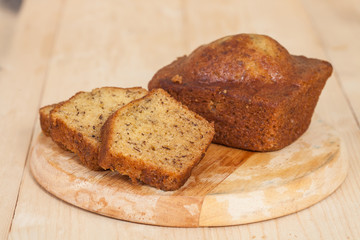 Homemade banana bread sliced on a table . rustic style