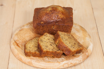 Homemade banana bread sliced on a table . rustic style