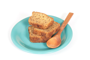 Homemade banana bread sliced on white background