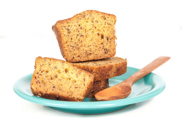 Homemade banana bread sliced on white background