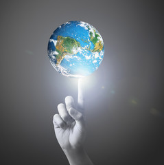  hand holding globe Elements of this image furnished by NASA