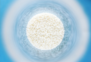 White rice for sushi in a round can.