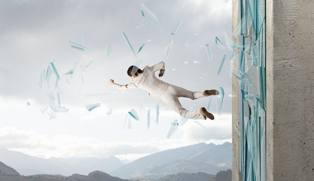 Woman Breaking Through Glass