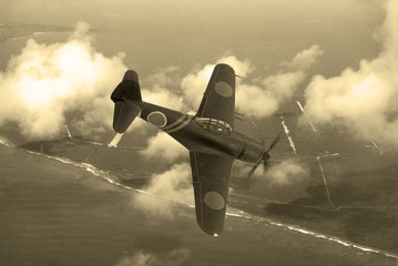 World War 2 era fighter plane. Japnese aricraft N1K-J Shiden known as 'Geroge' by the allies. Flying over the pacific Island of Saipan. (Computer Image, Artist's impression)