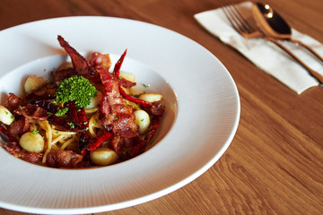 Spaghetti bacon and fried chillies