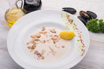 ready mussels in white dish