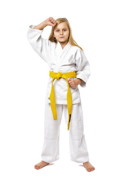 Beautiful blonde girl in kimono training martial art