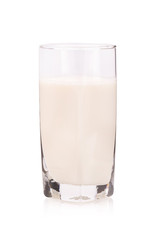 glass of warm milk on white background