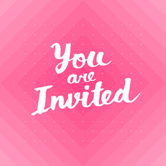You are invited card with hand drawn lettering design with polka dots pattern on background.