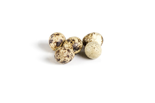Raw guail eggs isolated on white background