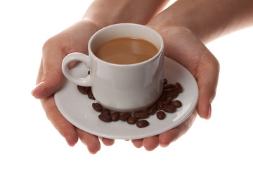 cup of coffee with spoon and hand on white background
