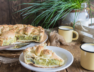 Homemade pie stuffed with potato and mushrooms