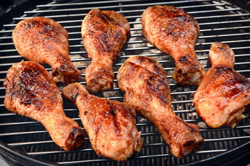 BBQ Chicken Legs Roasted On Hot Charcoal Grill