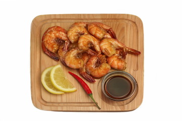 Grilled King Size Shrimps With Sauce Served On Wood Board