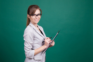 girl teacher with a folder and pen