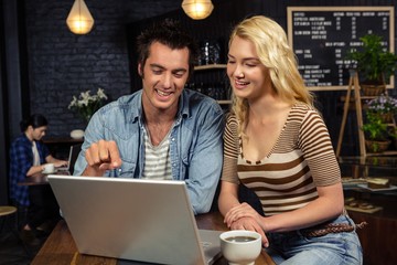 Couple using a laptop