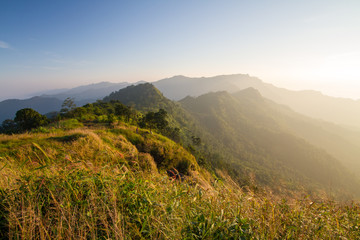 Fototapeta premium Sunrise with fog on mountain valley. Natural summer landscape