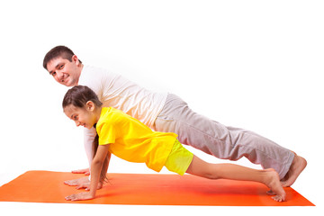 dad practicing yoga with daughter isolated