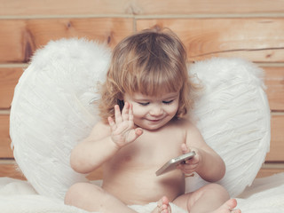 Angel boy with phone