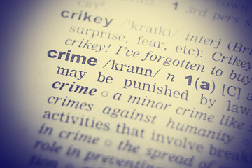 Fototapeta premium Dictionary definition of the word Crime in English. Vignetting effect.