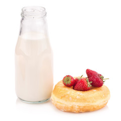 Milk bottle and donut on white background