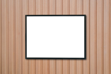 Mock up blank poster picture frame on wood wall.