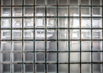 Wall of classical glass blocks as background.