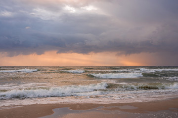 Landscape stormy sea at sunset