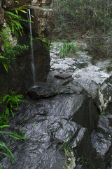 Naklejka na ściany i meble J C Slaughter Falls is a cascade waterfall located near Mt Coot-tha in Brisbane, Queensland, Australia
