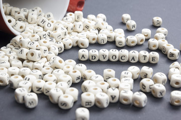 Advocate word written on wood block. Wooden ABc