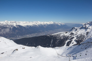 Skiing At Axamer Lizum With View To Innsbruck In Tyrol Austria