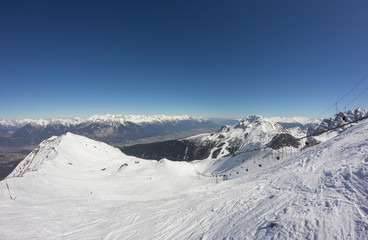 Skiing At Axamer Lizum With View To Innsbruck In Tyrol Austria