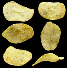 Set of potato chips on black background isolated
