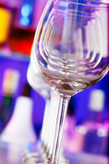 Many wine glasses one after another in bar