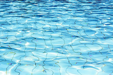 Fototapeta premium Background of rippled water in swimming pool / Blue ripped water in swimming pool (swimming, pool, wave)