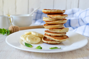 Pancakes for breakfast with honey and blueberries