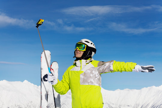 Taking selfie with ski over mountain