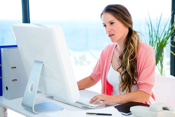 concerned business woman on her computer