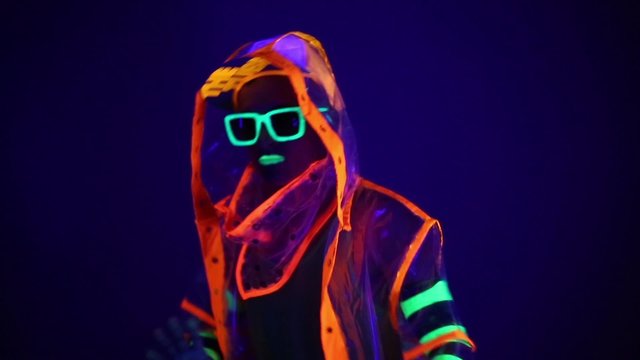 Guy dancing in neon costume