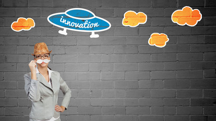 Businesswoman trying paper mustache