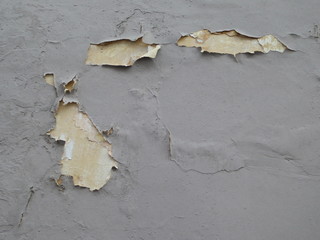 Peeling paint on a concrete wall