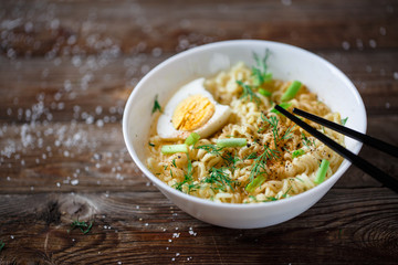 Asian noodles with fresh green onion and boiled egg