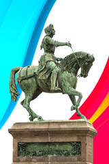 Obraz premium Statue de Jeanne d'Arc à Orléans sur fond de drapeau français.