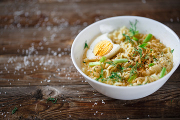 Asian noodles with fresh green onion and boiled egg