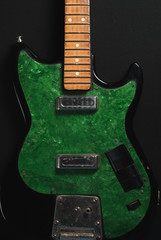 electric guitar without strings on wooden background