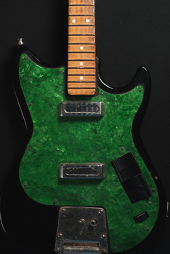 electric guitar without strings on wooden background