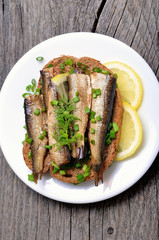 Sandwich with sprats and green onion