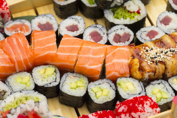 Big sushi set on a wooden background