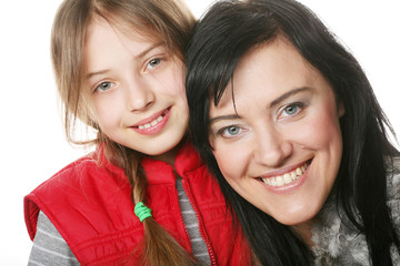 mother and her daughter smiling at the camera